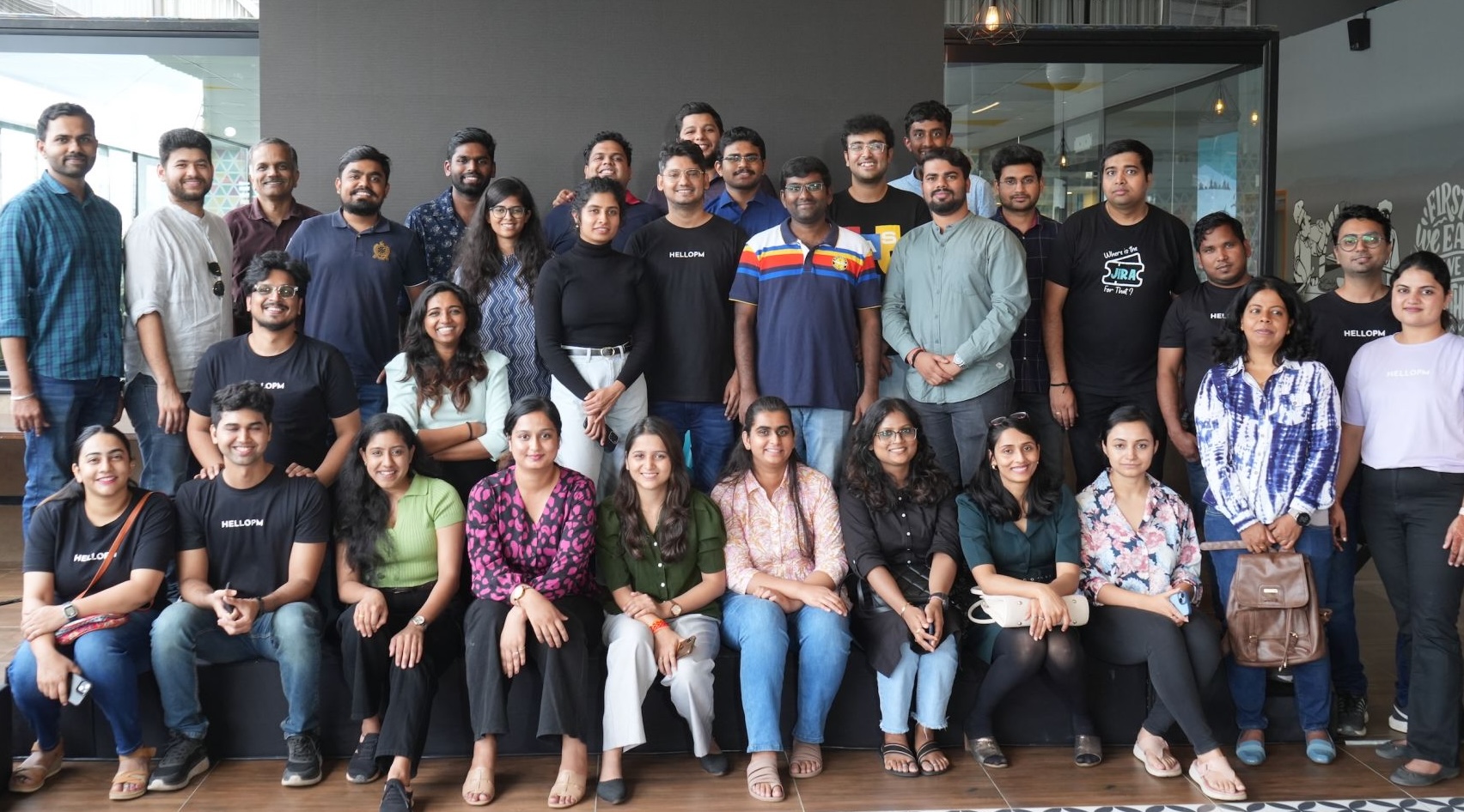 A packed HelloPM community meetup in Bengaluru, dozens of product people together in HelloPM tees