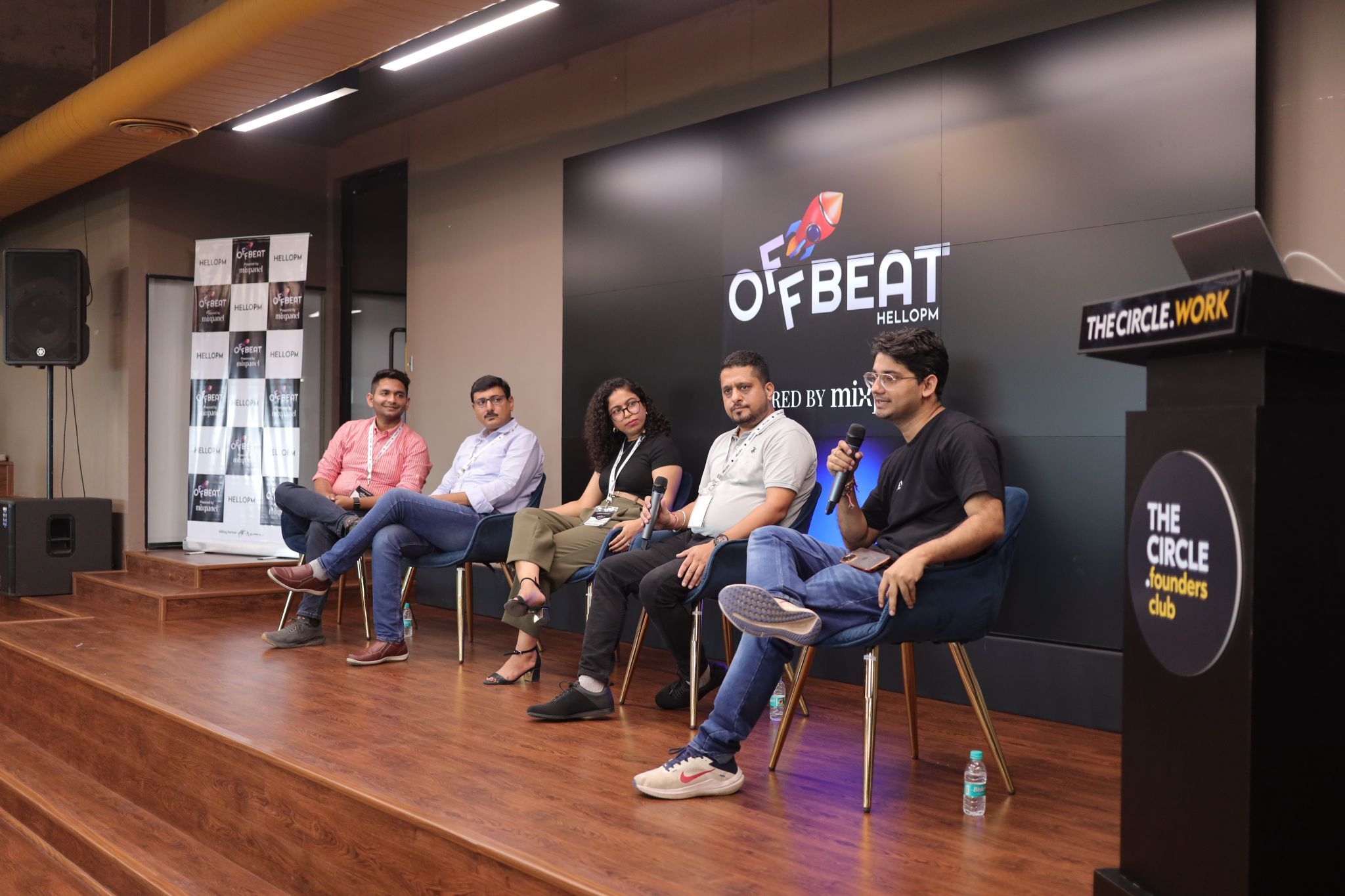An Offbeat by HelloPM panel discussion with five speakers on stage