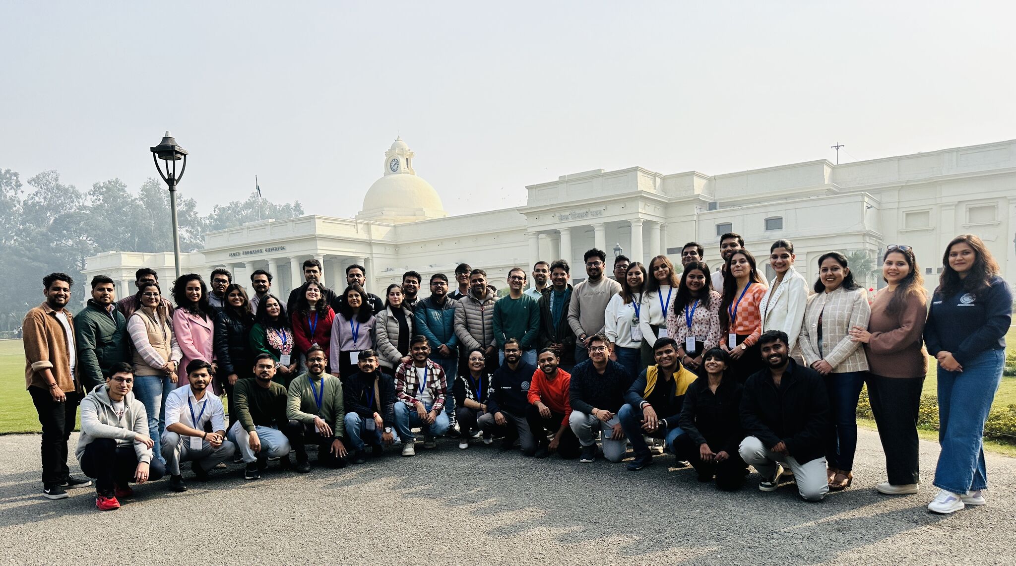 A large HelloPM group on the IIT Roorkee campus in front of the iconic main building
